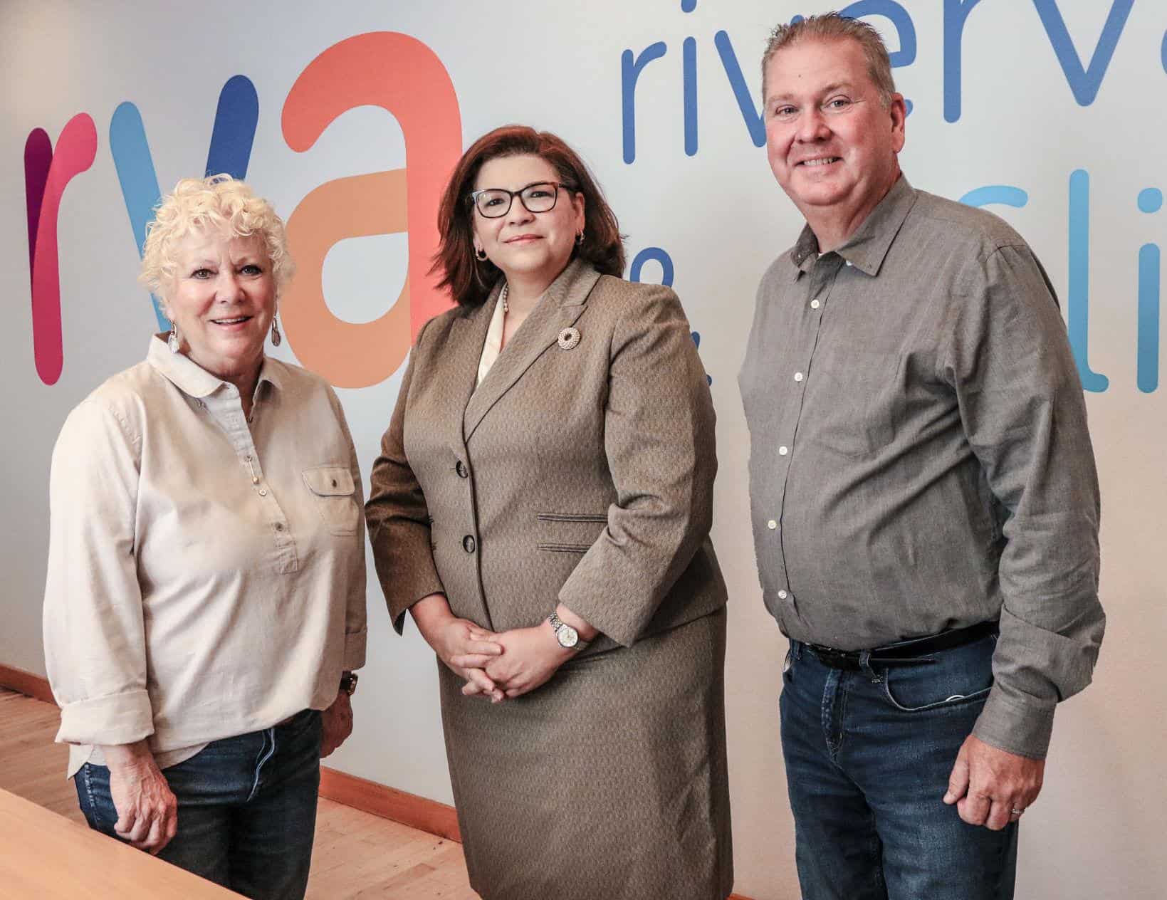 RiverValley Behavioral Health’s Mary Kay Lamb, vice president of case management services, from left, Dr. Wanda Figueroa, president and CEO, and Jeff Jones, board chair, stand Tuesday in the conference room at the facility in Owensboro.